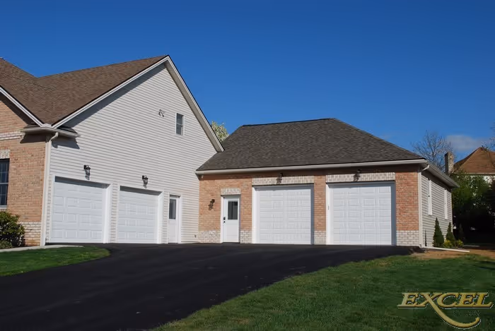 Exterior view of a modern garage with multiple doors in a residential area in harrisburg, pa.