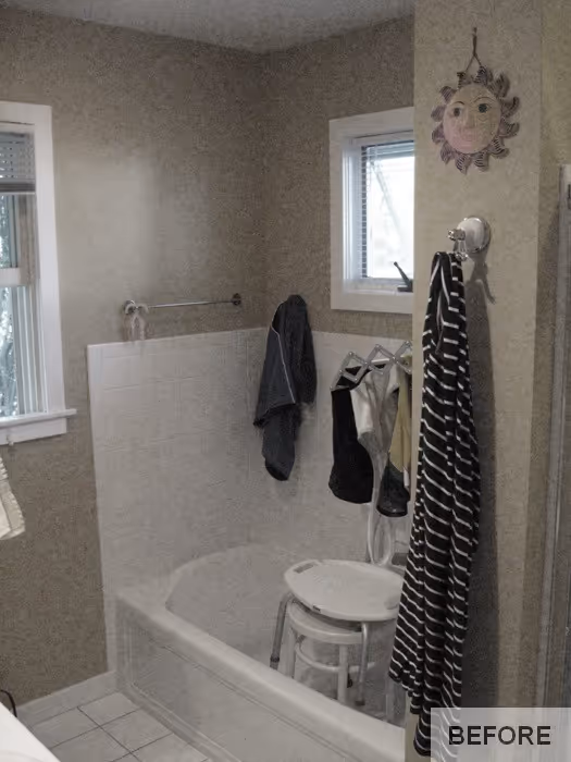 Small bathroom in a transitional style with light beige walls and white tiled bathtub in Hummelstown, PA