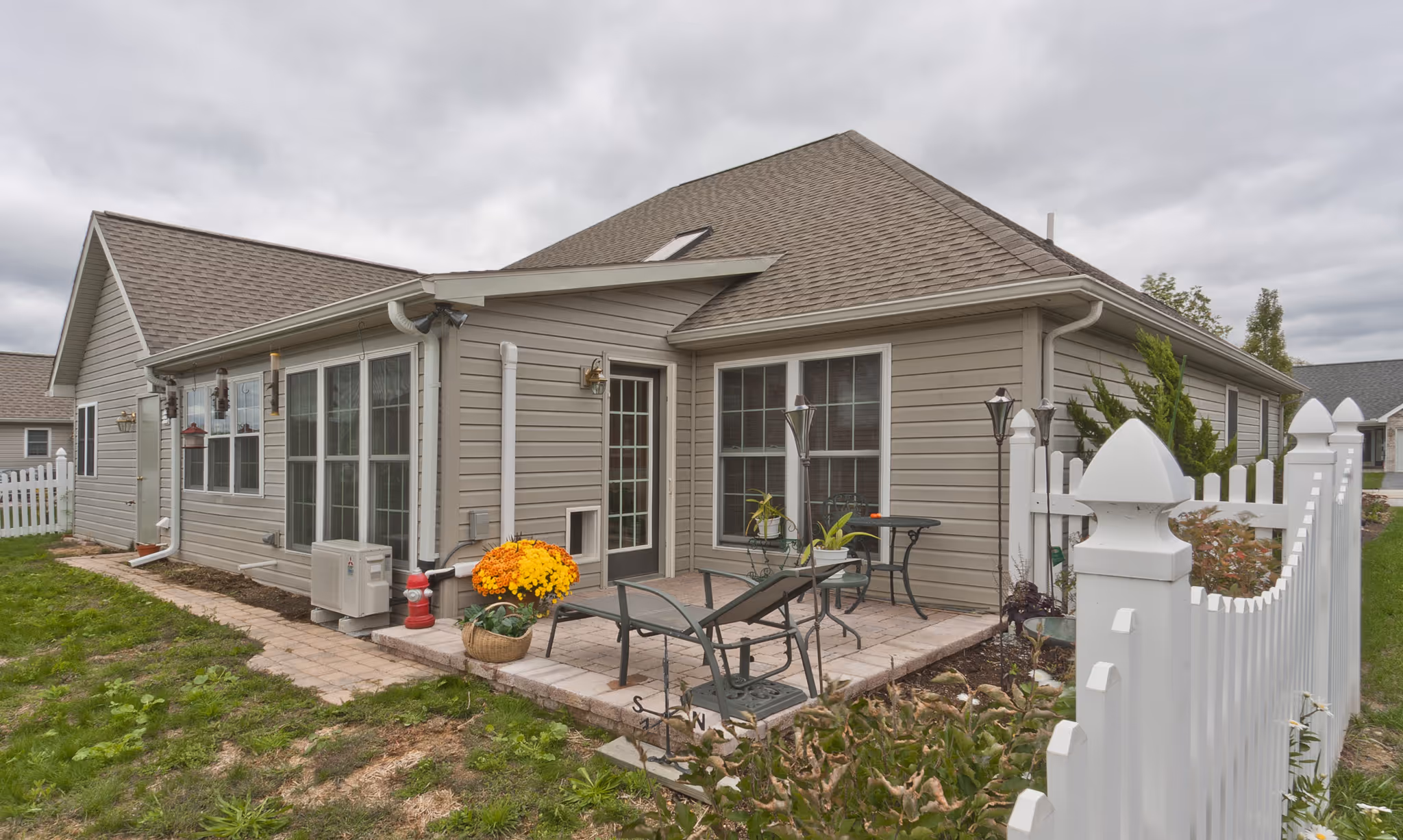 Cozy outdoor patio with chairs and flower pots in mechanicsburg, pa