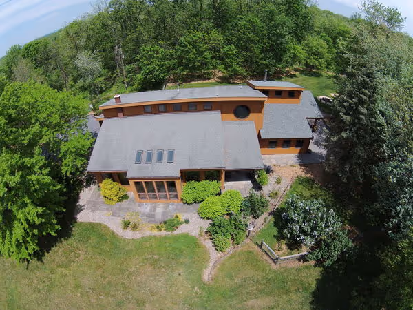Modern passive solar home exterior featuring landscaped garden in mechanicsburg, pa