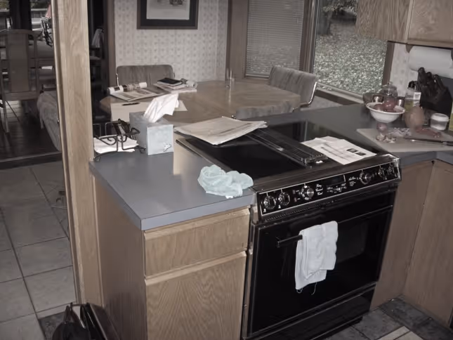 Modern kitchen with black appliances and wooden cabinetry in Carlisle, PA.
