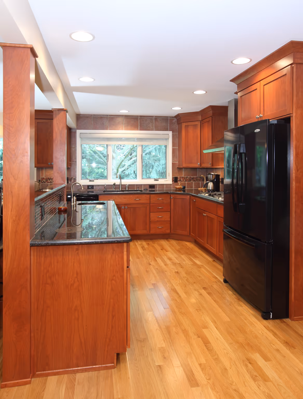 Modern kitchen with wood cabinets and granite countertops in Carlisle, PA.