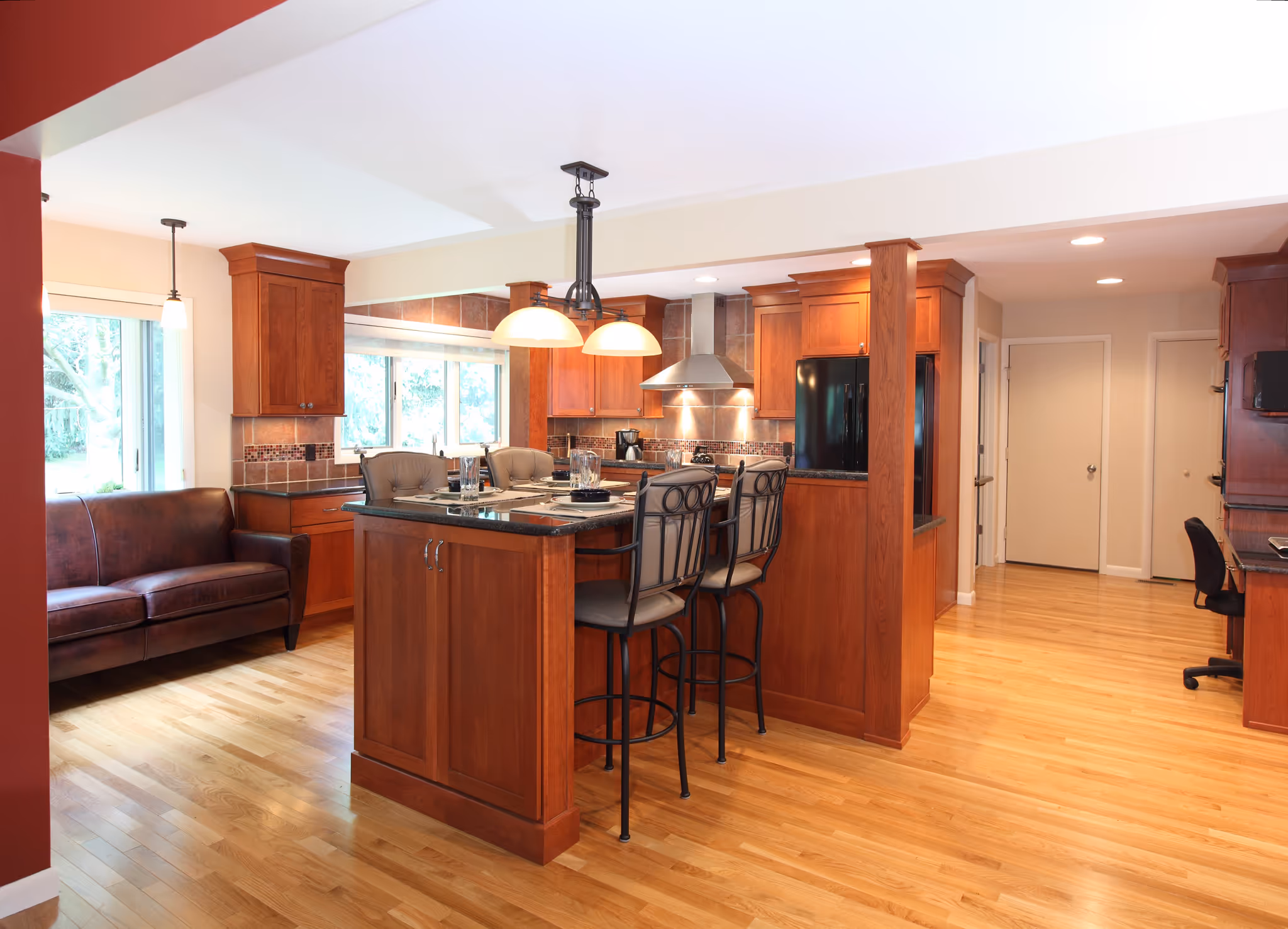 Contemporary kitchen with wood cabinets, a large island, and a comfortable seating area in Carlisle, PA