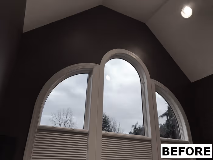 Stylish office with arched windows and a unique dark wall design in Mechanicsburg, PA.
