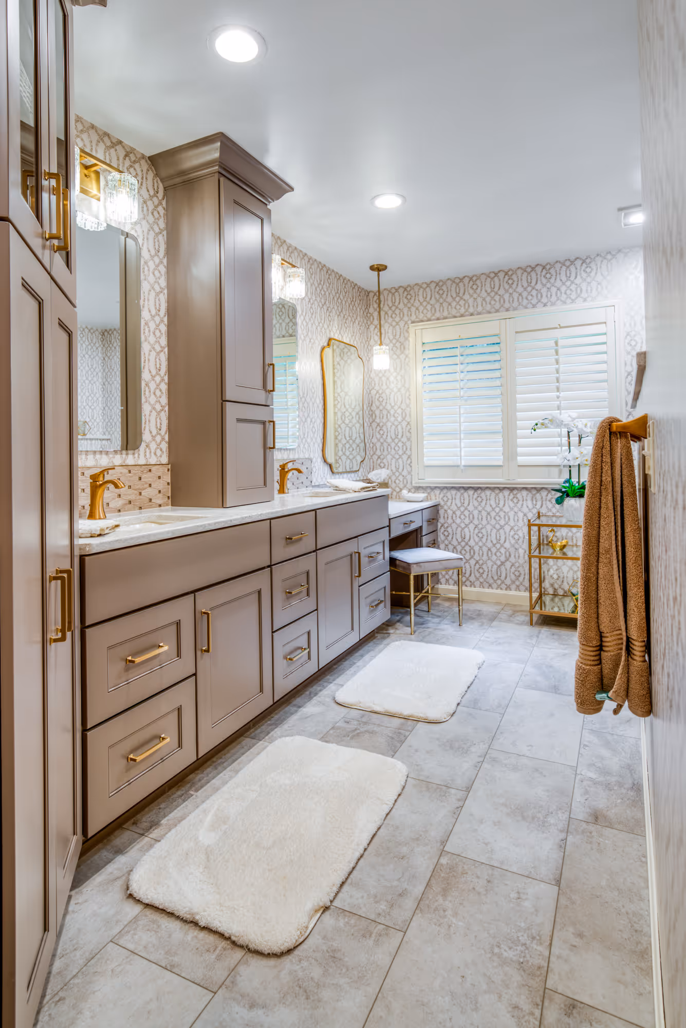 Elegant primary bathroom remodel in Mechanicsburg, PA featuring modern cabinetry, stylish lighting, and soft neutral colors.