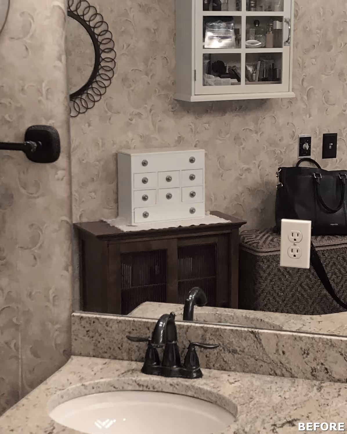 Small bathroom with floral wallpaper, a white cabinet, and a dark wood vanity in Mechanicsburg, PA.