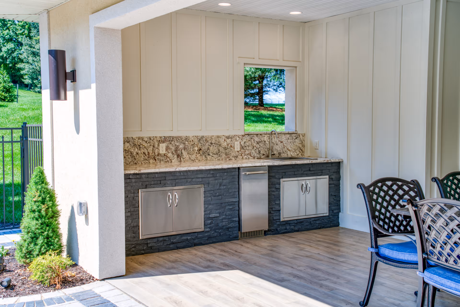 Modern outdoor kitchen featuring granite countertops and sleek cabinetry, located in Mechanicsburg, PA.