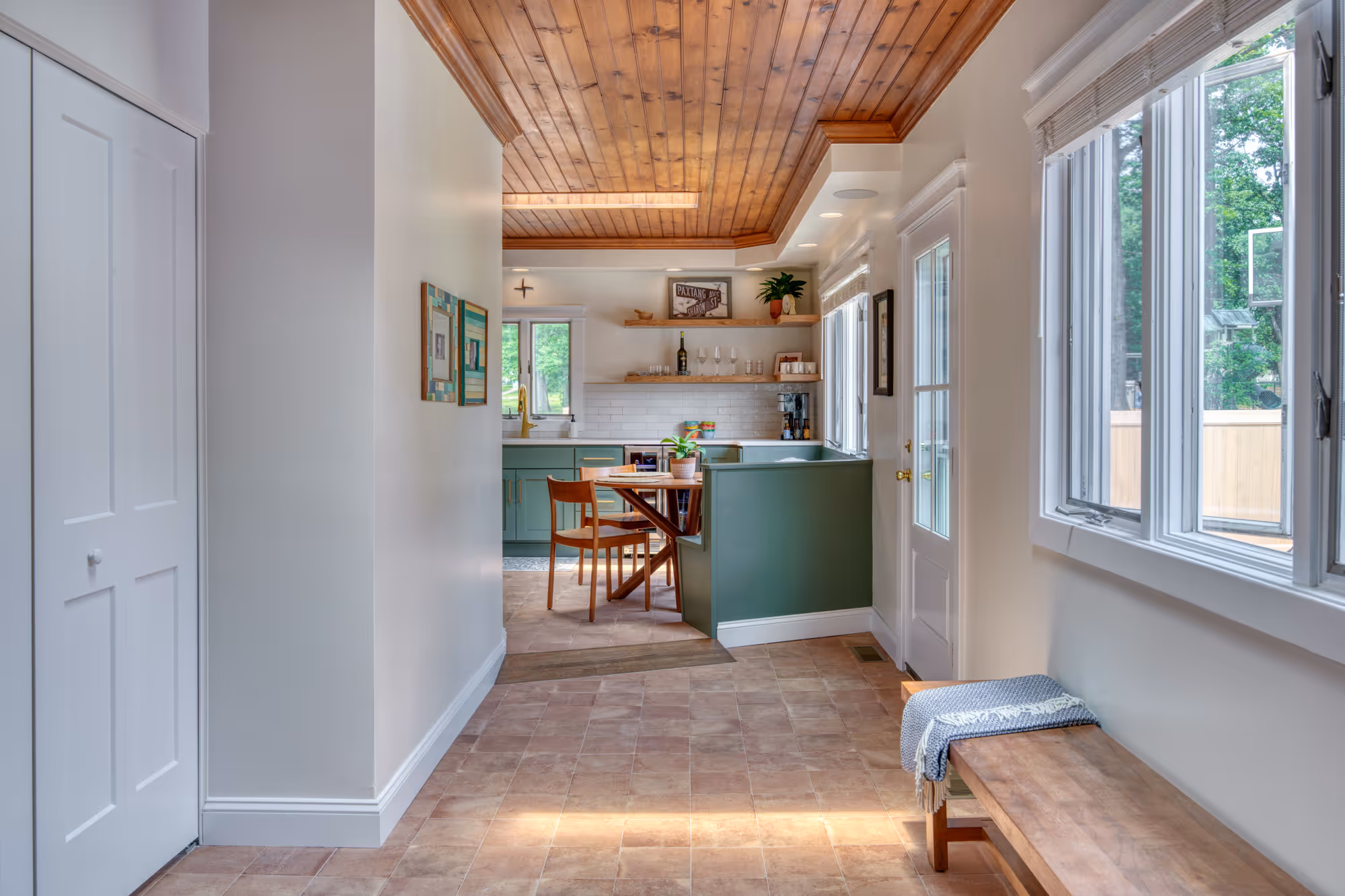 Contemporary kitchen entry with green cabinetry and wooden ceiling in Harrisburg, PA.