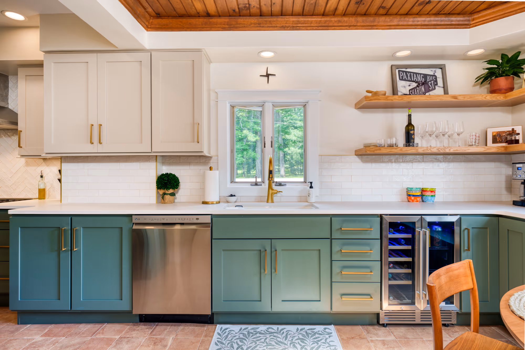 Modern kitchen with white and green cabinetry, stainless steel appliances, and a cozy atmosphere in harrisburg, pa