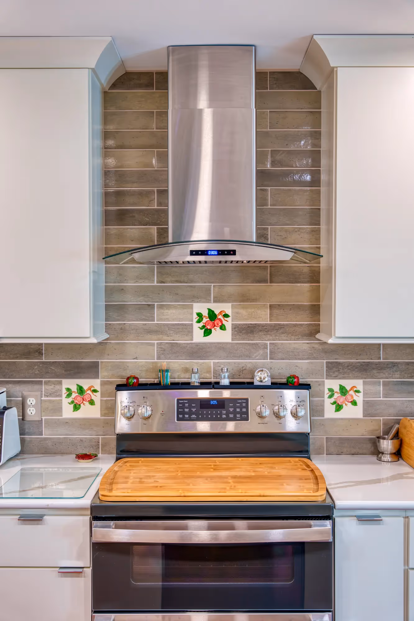 Modern kitchen with white cabinetry and sleek appliances