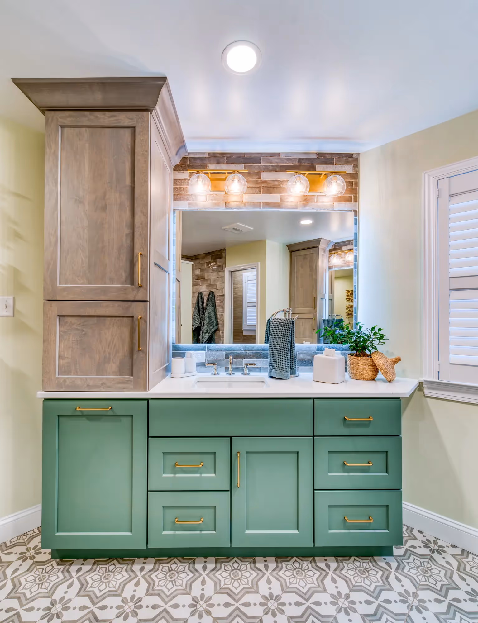 Renovated mudroom with green storage cabinets