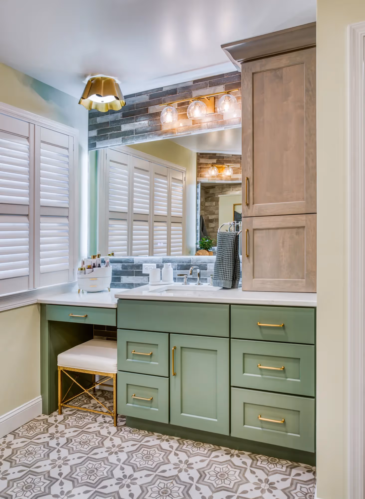 Renovated mudroom with green cabinets