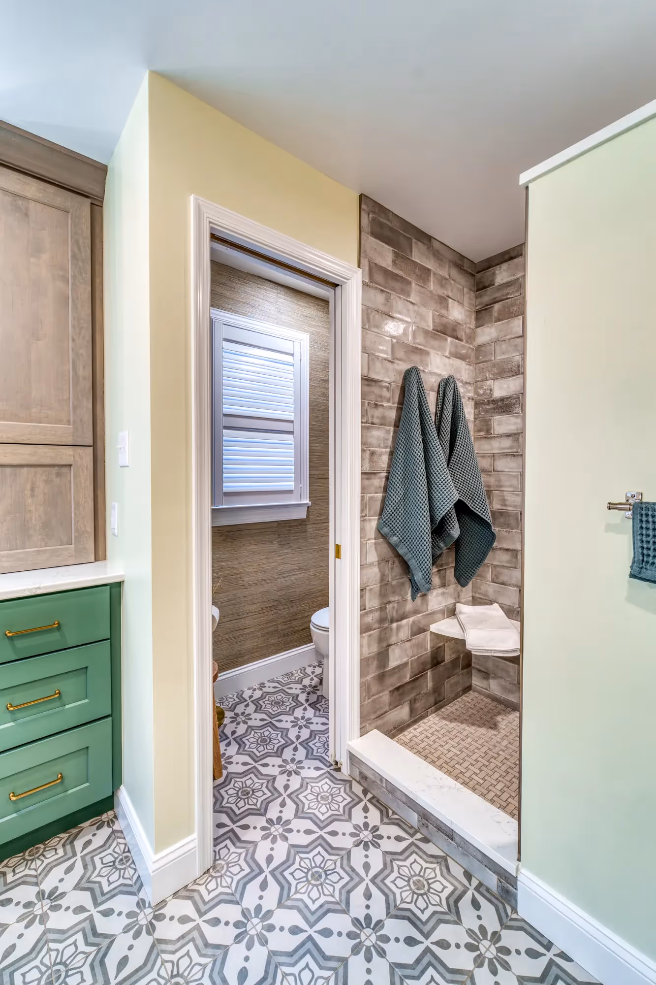 Modern bathroom with green cabinets