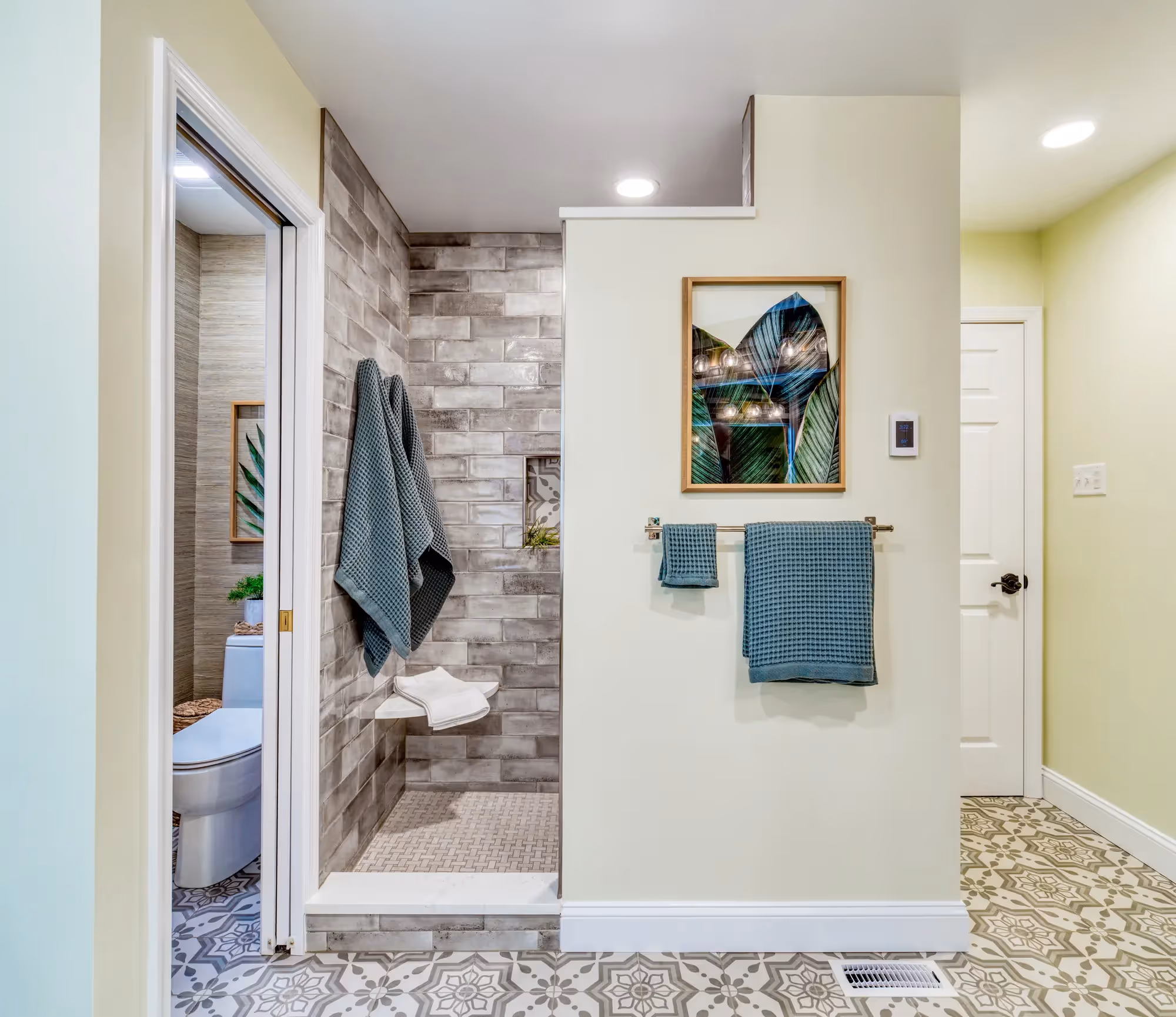 Renovated mudroom with green cabinets
