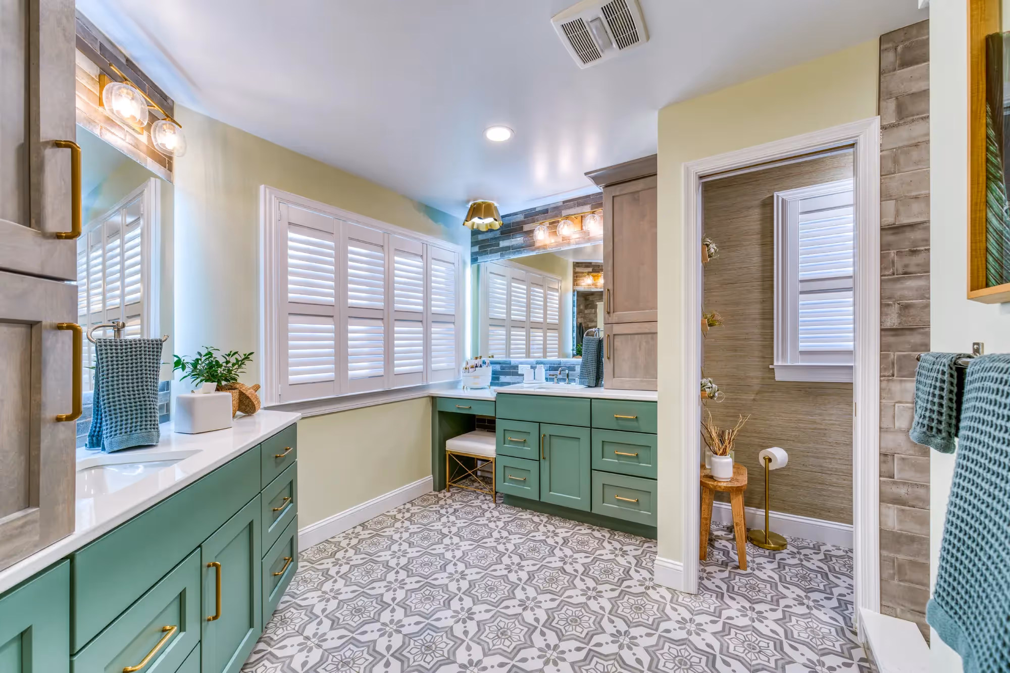 Renovated mudroom with green cabinets and natural light