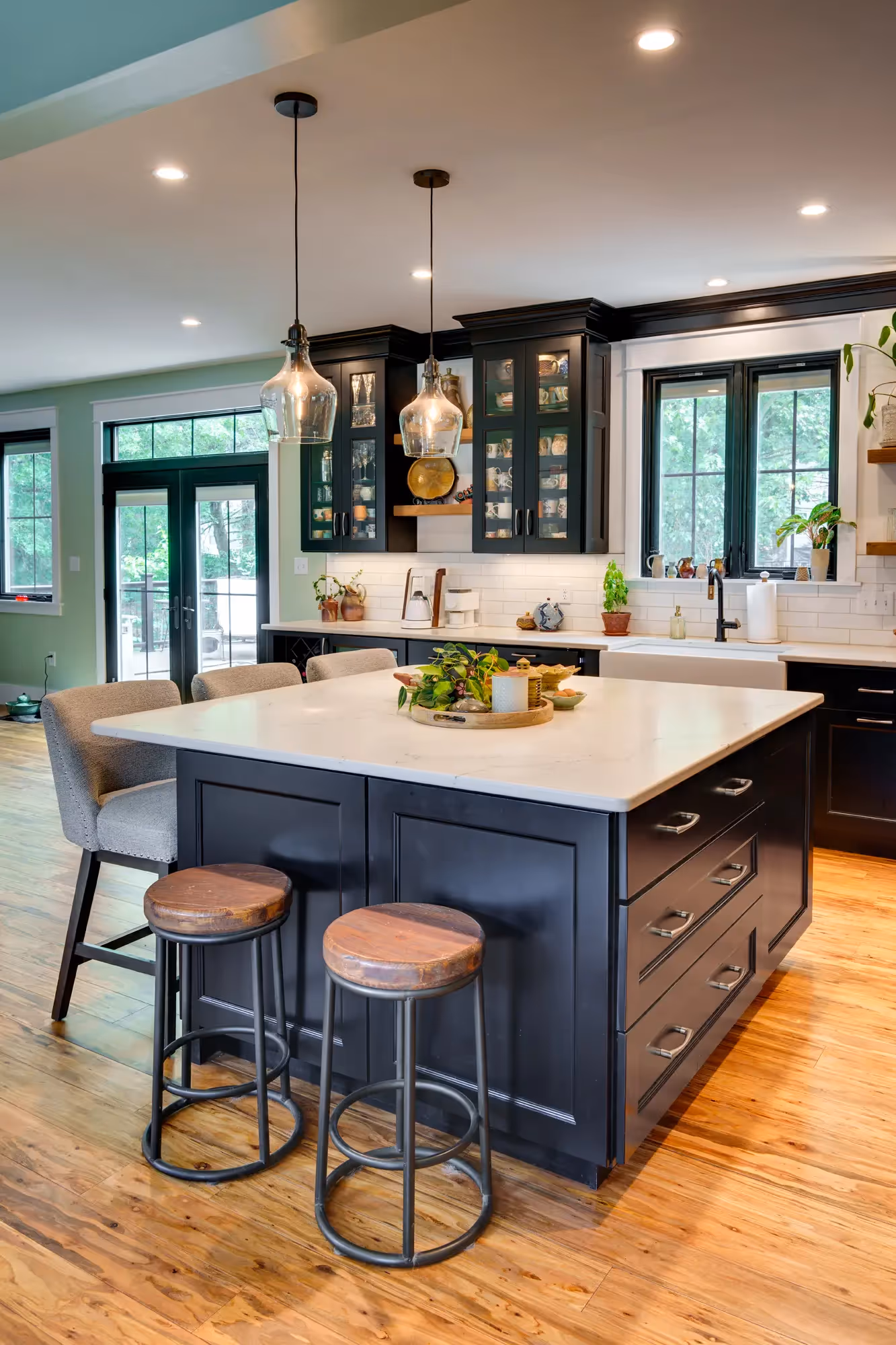 Bright and organized kitchen with dark cabinets