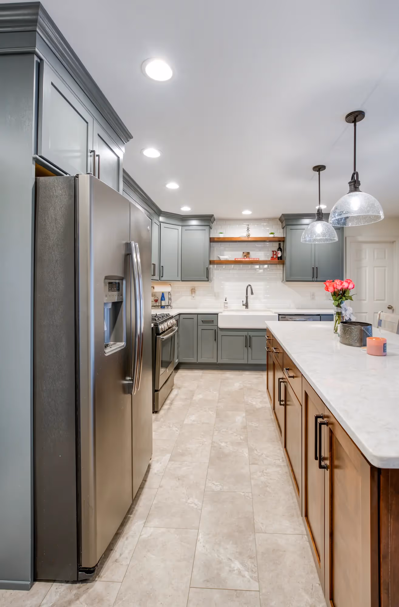 Close-up of the kitchen island with bar stools and wooden accents