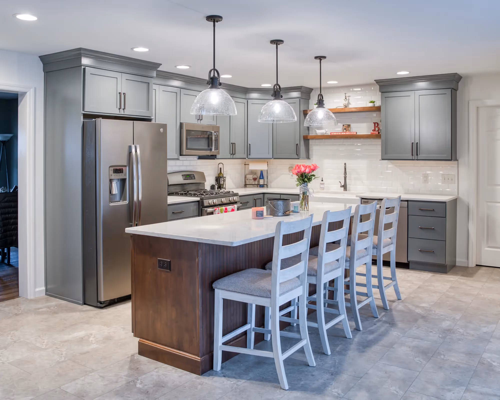 Bright kitchen with an island, pendant lights, and modern cabinetry