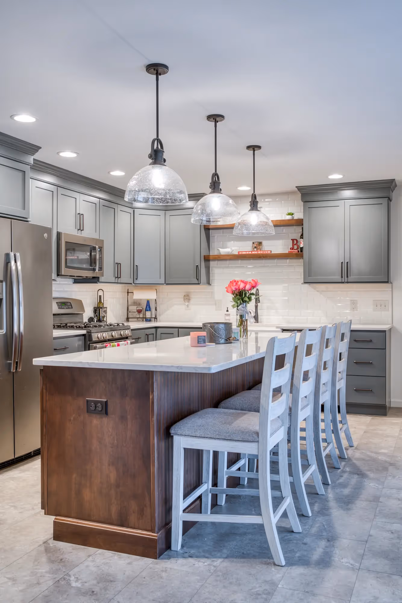 Close-up of the kitchen island with bar stools and wooden accents