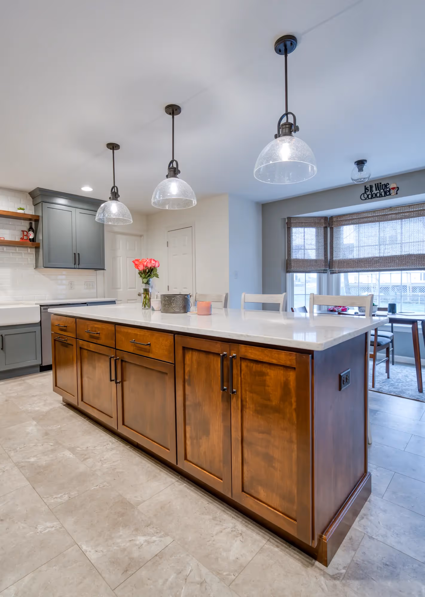 Close-up of the kitchen island with bar stools and wooden accents