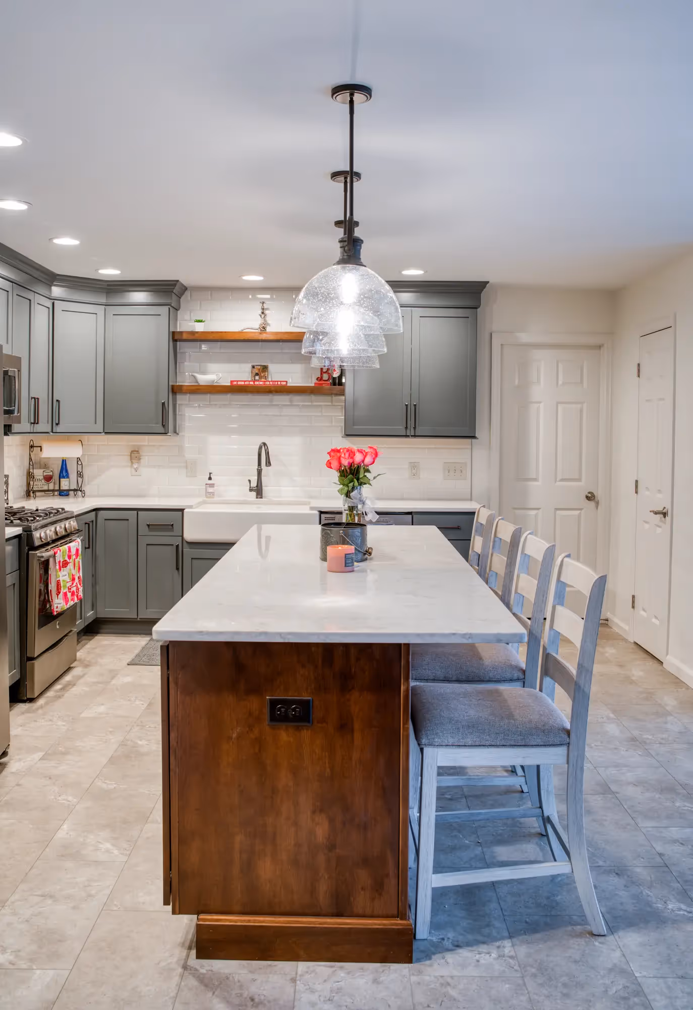 Close-up of the kitchen island with bar stools and wooden accents