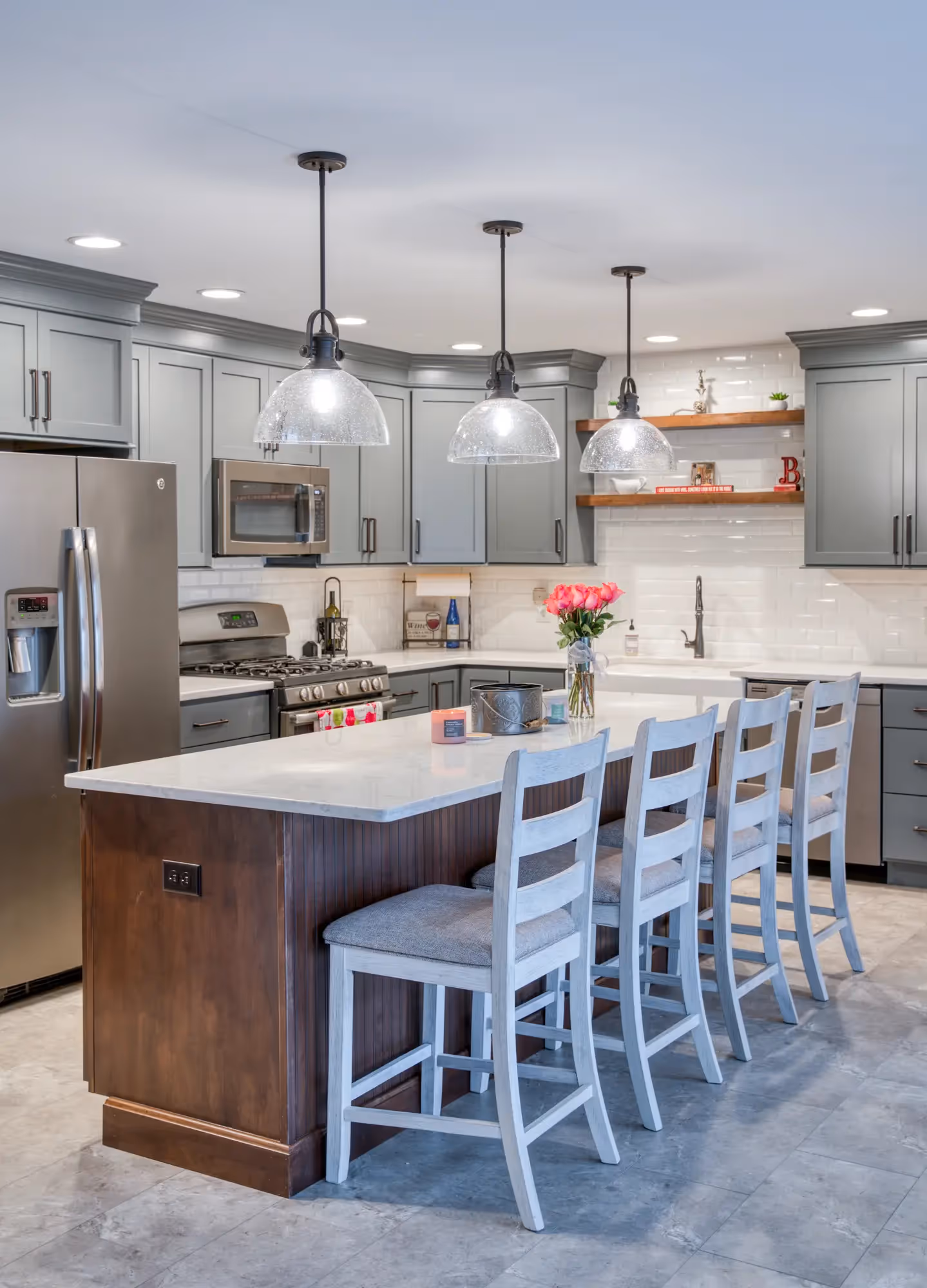 Bright kitchen with an island, pendant lights, and modern cabinetry