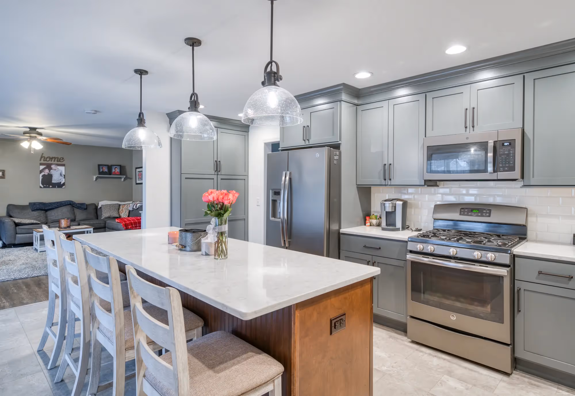 Bright kitchen with an island, bar stools
