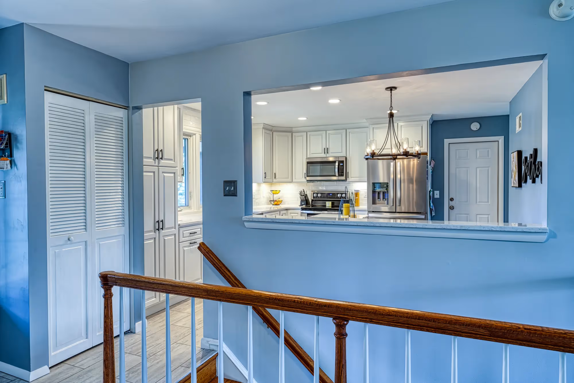 kitchen with blue walls, clean countertops.