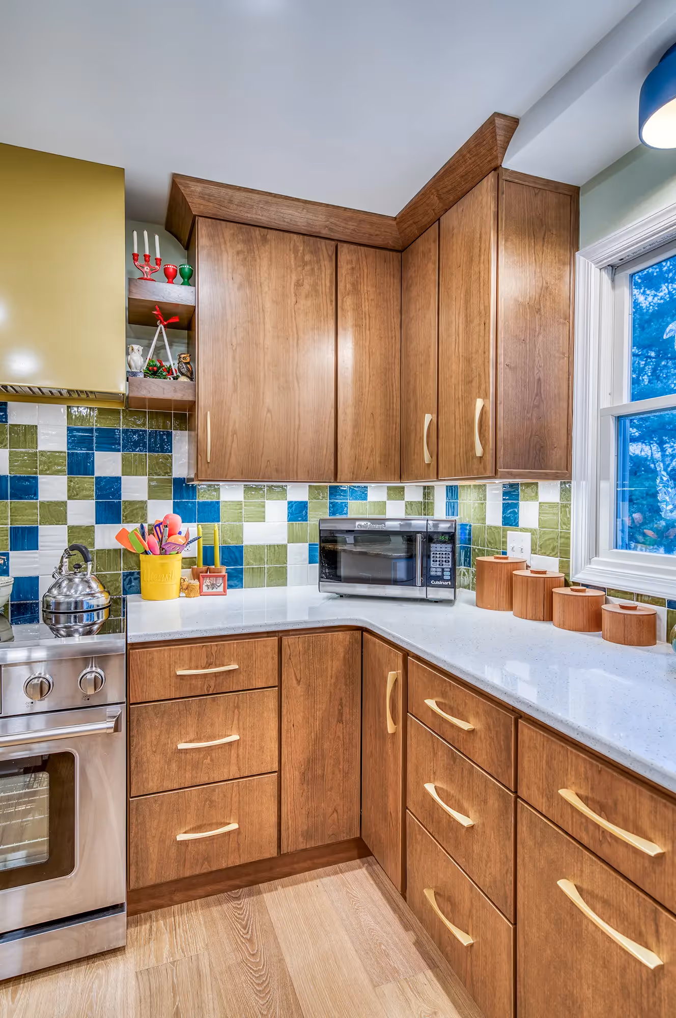 Kitchen with colorful tiles, wooden cabinets