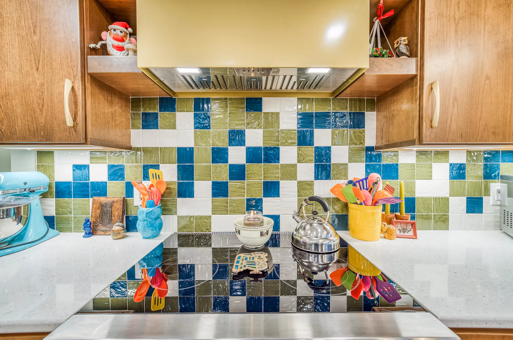 Kitchen with colorful tiles, wooden cabinets