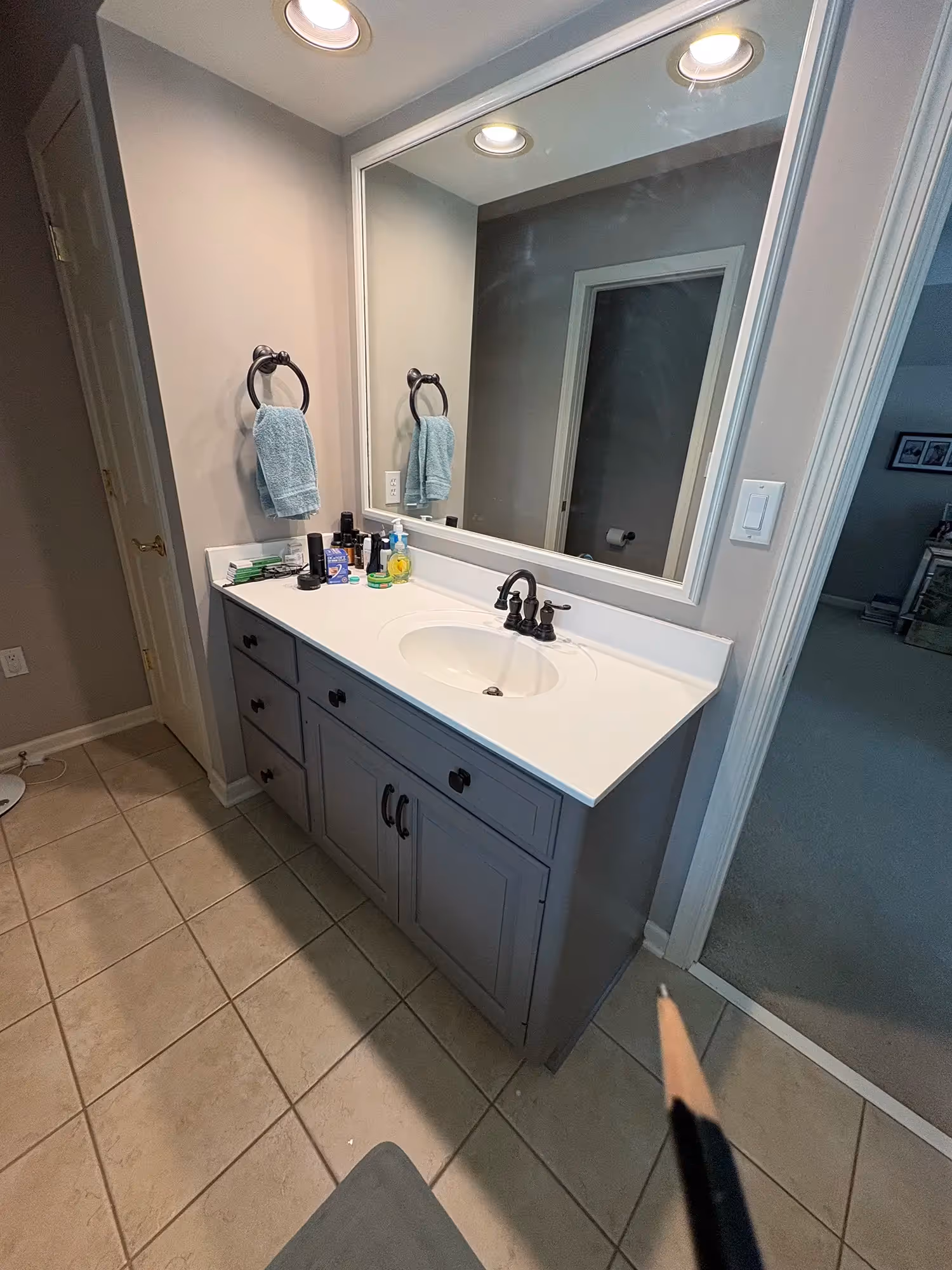Bathroom with tub, neutral-colored walls