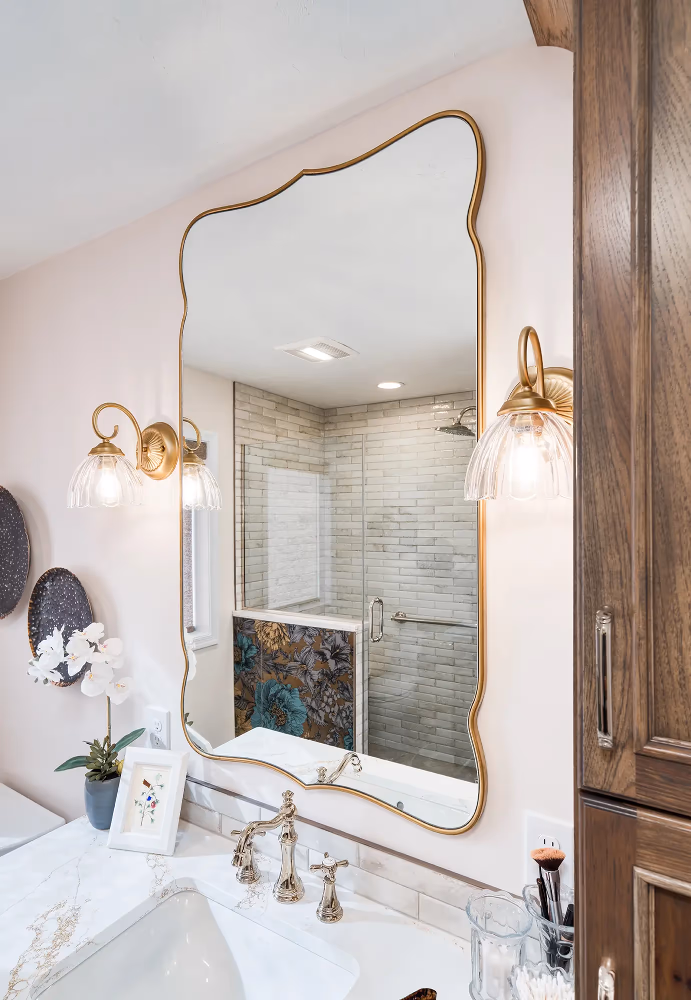 Spacious bathroom with dual sinks, wooden cabinetry