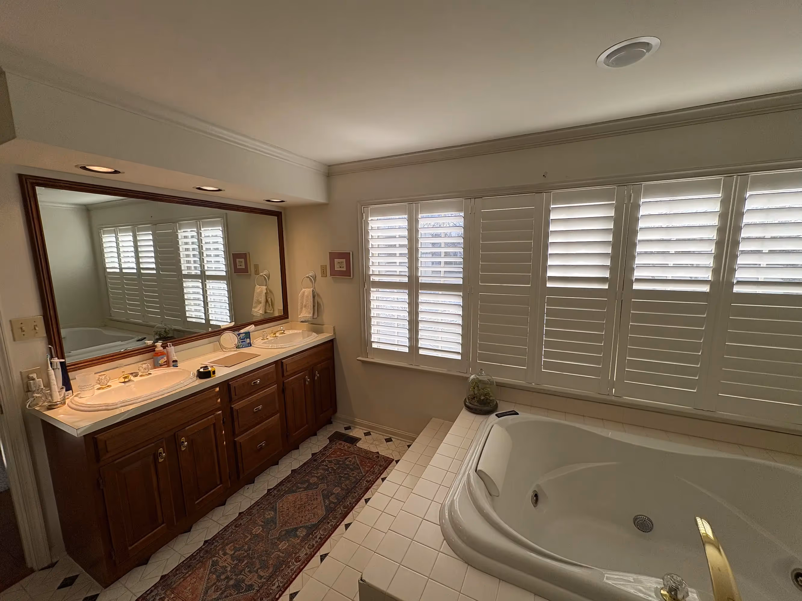 Bathroom with bathtub, patterned floor tiles