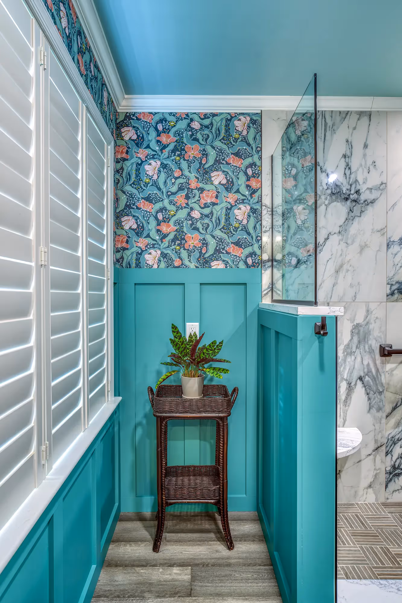 Bathroom with marble tiles, sleek shower design.