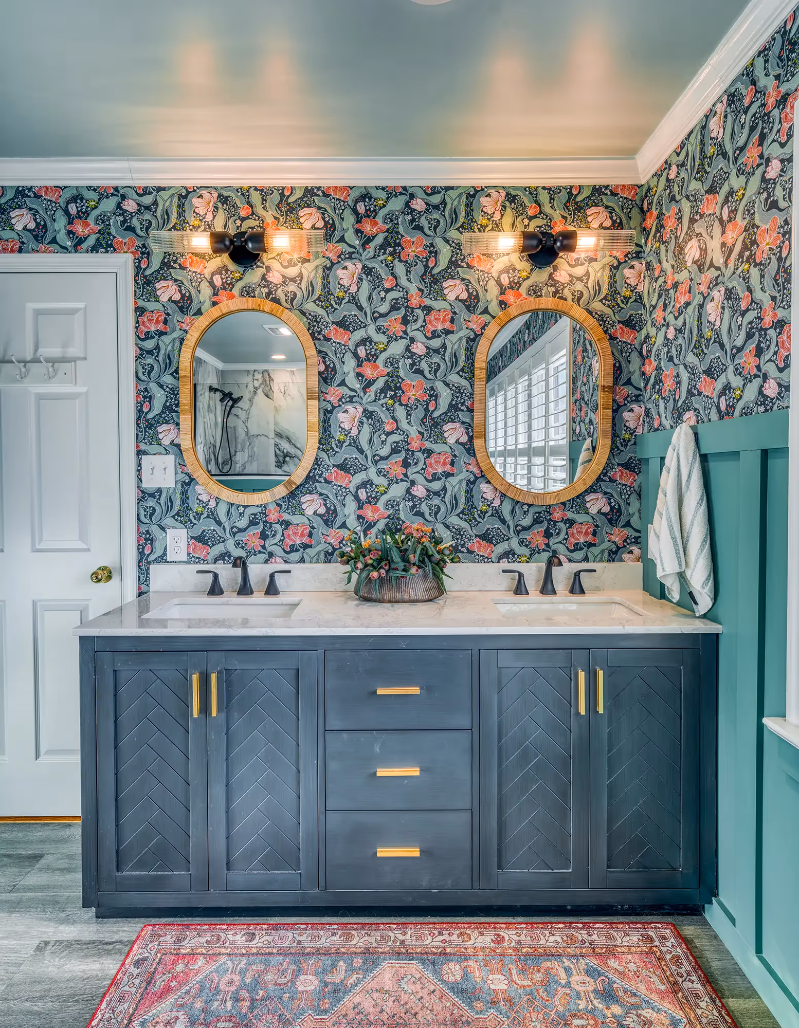 Bathroom with teal walls, floral wallpaper