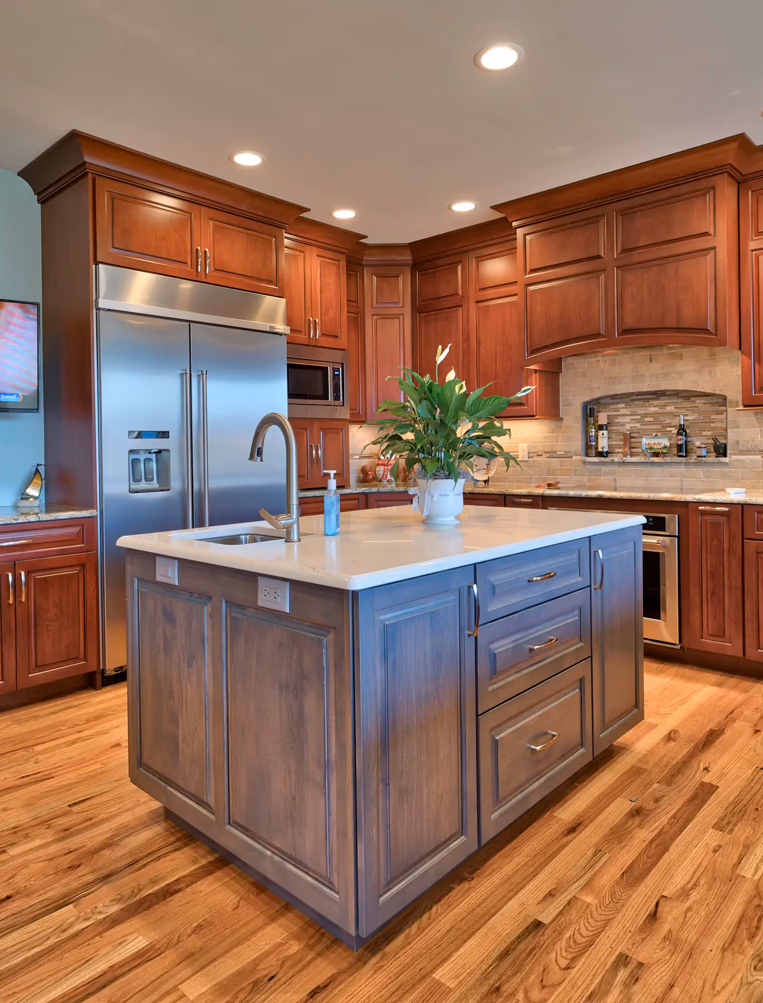Transitional-style kitchen featuring a mix of rich, warm wood cabinetry