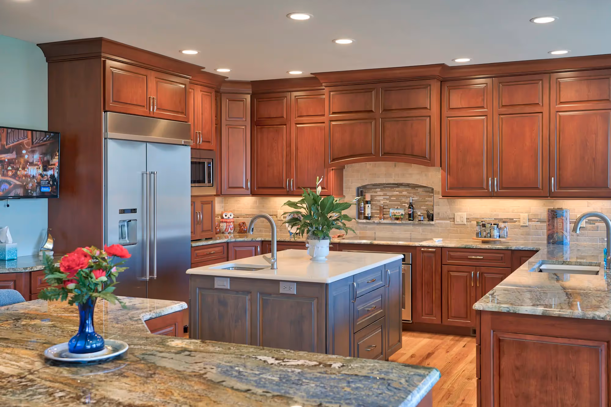 Transitional-style kitchen featuring a mix of rich, warm wood cabinetry