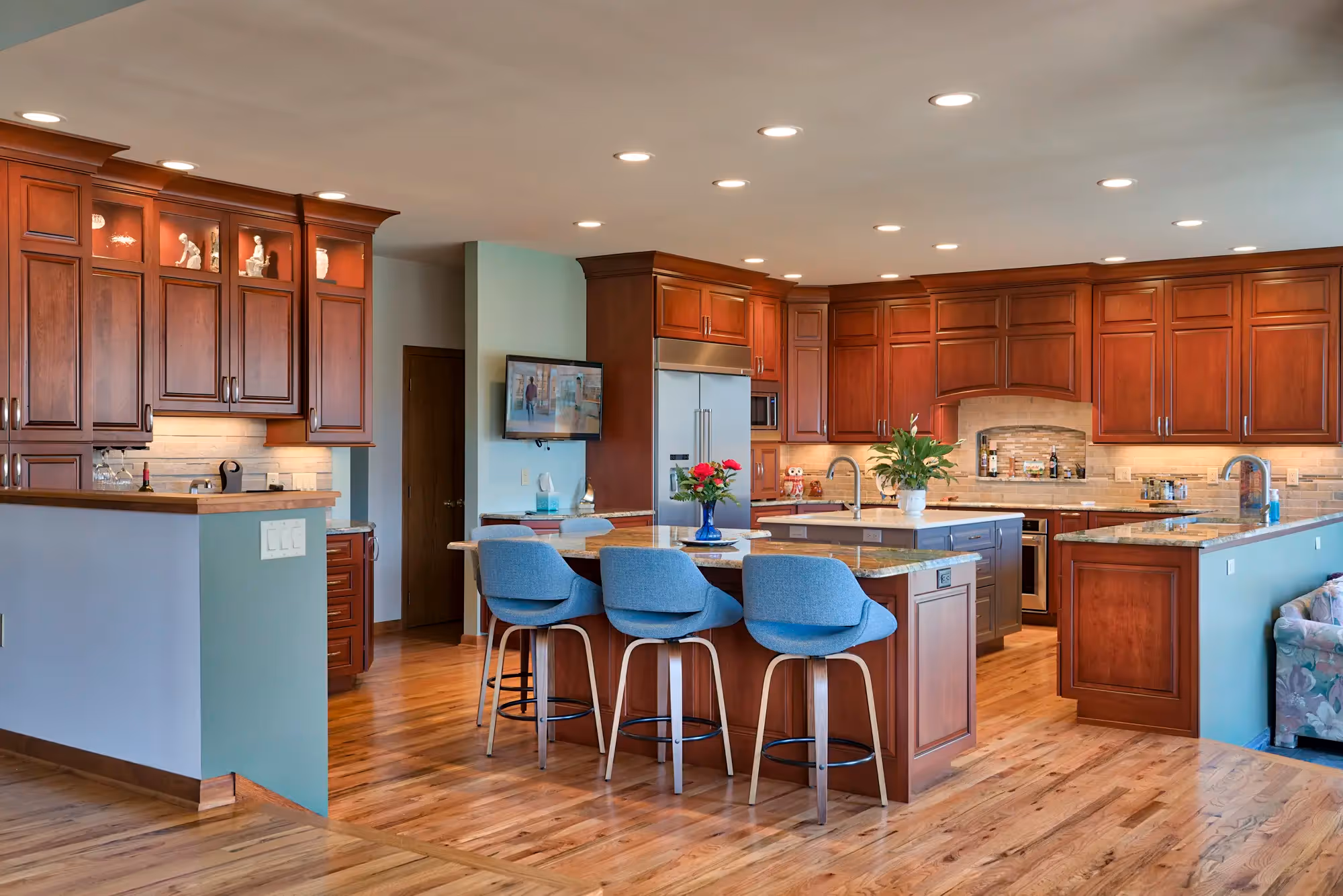 Transitional-style kitchen featuring a mix of rich, warm wood cabinetry
