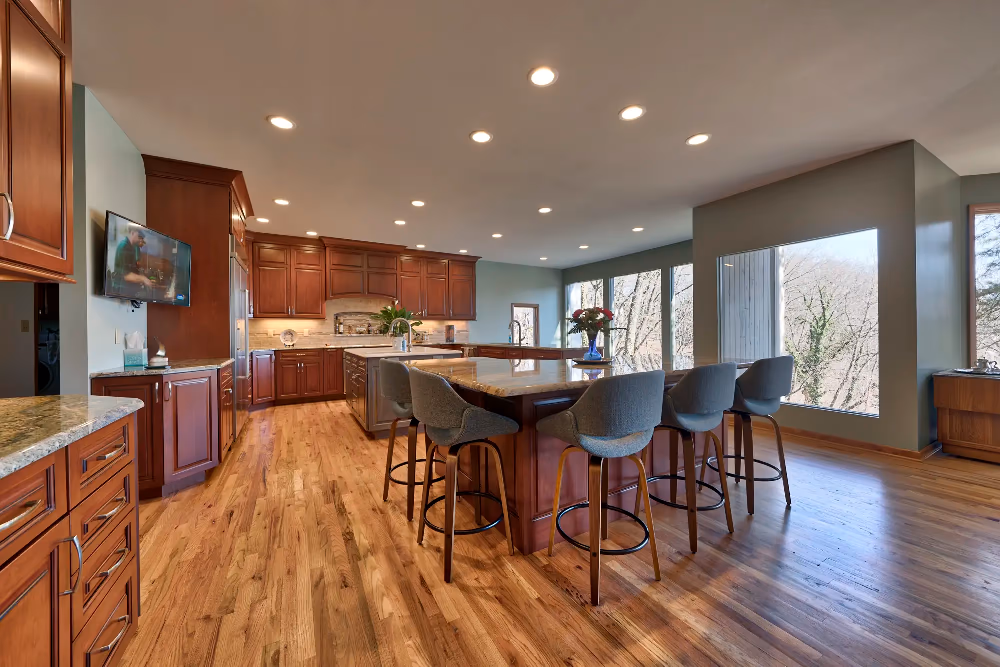 Transitional-style kitchen featuring a mix of rich, warm wood cabinetry