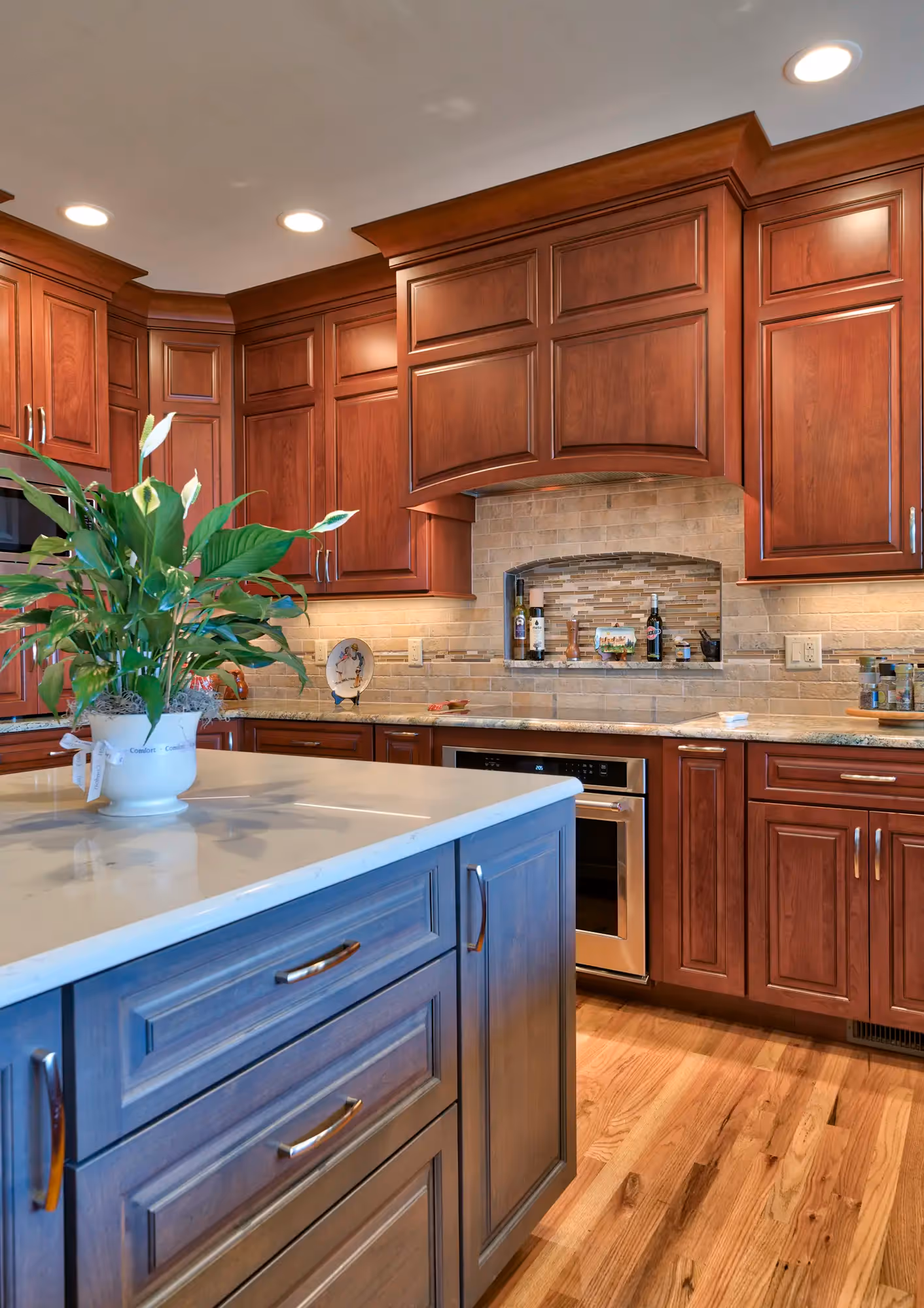 Transitional-style kitchen featuring a mix of rich, warm wood cabinetry