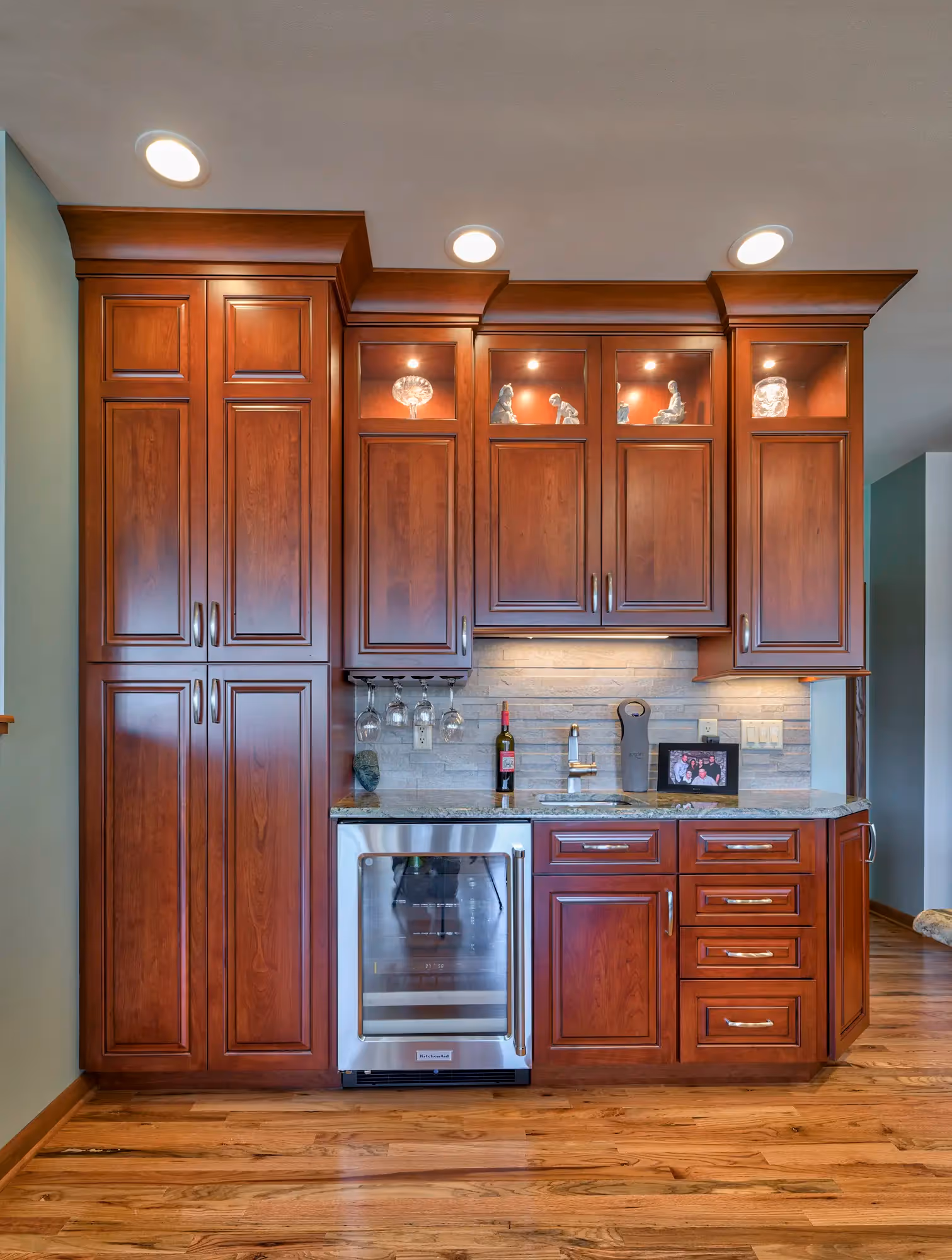 Transitional-style kitchen featuring a mix of rich, warm wood cabinetry