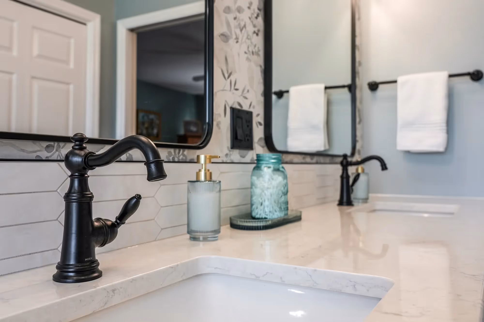 Shower wall with black fixtures, and contemporary styling