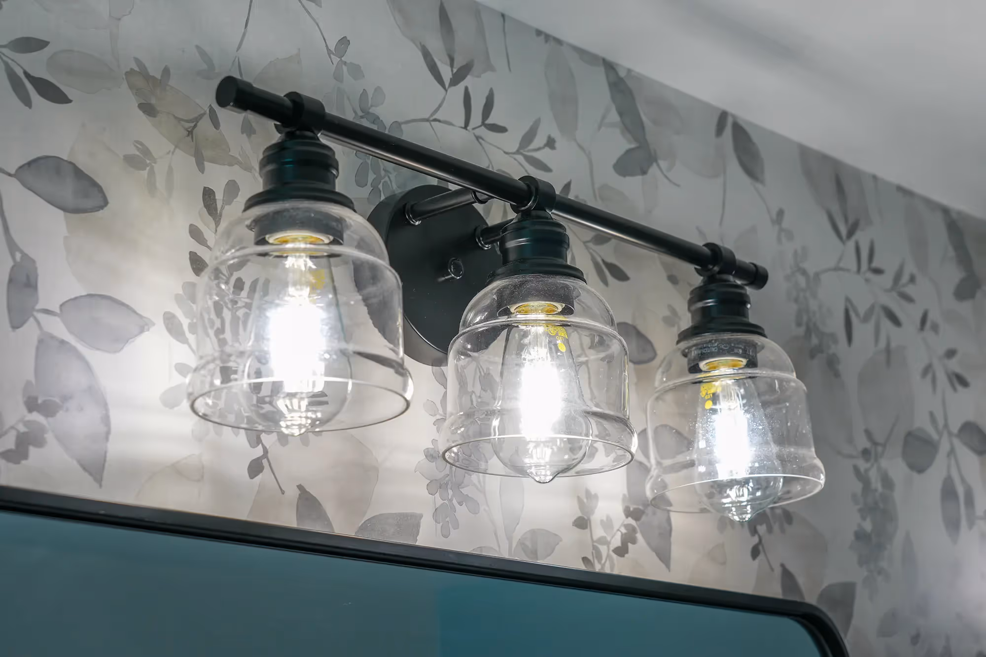 Shower wall with black fixtures, and contemporary styling