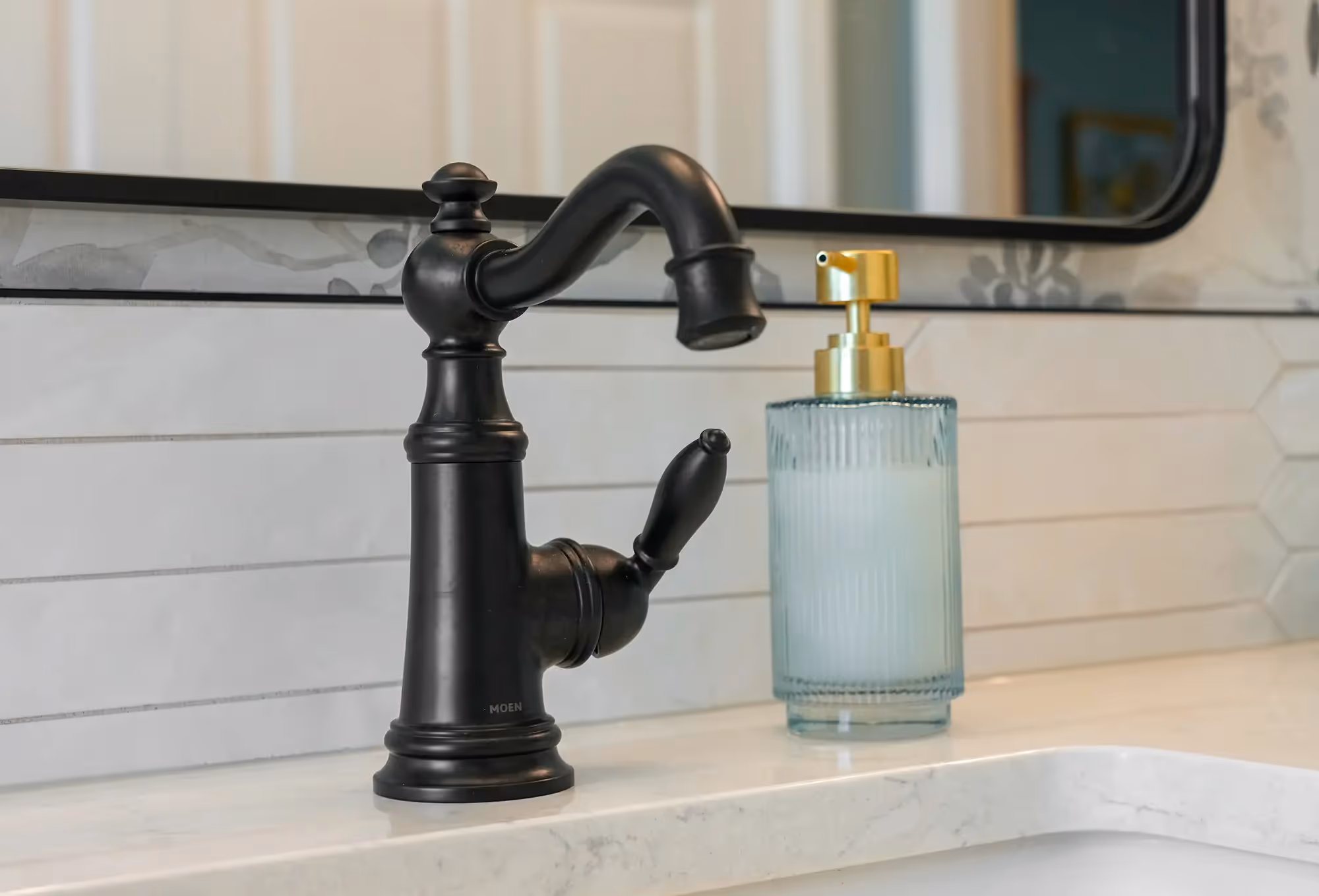 Shower wall with black fixtures, and contemporary styling
