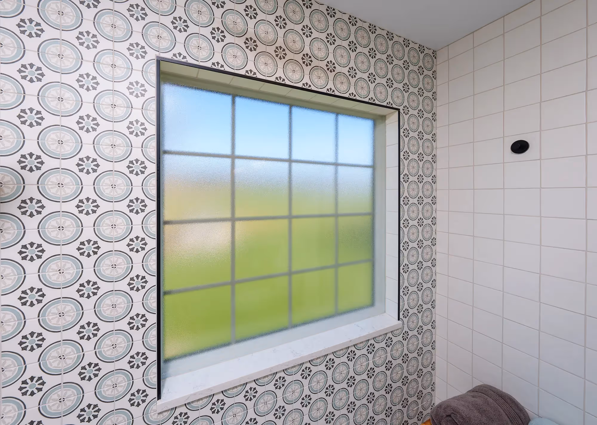 Stylish shower area with black fixtures