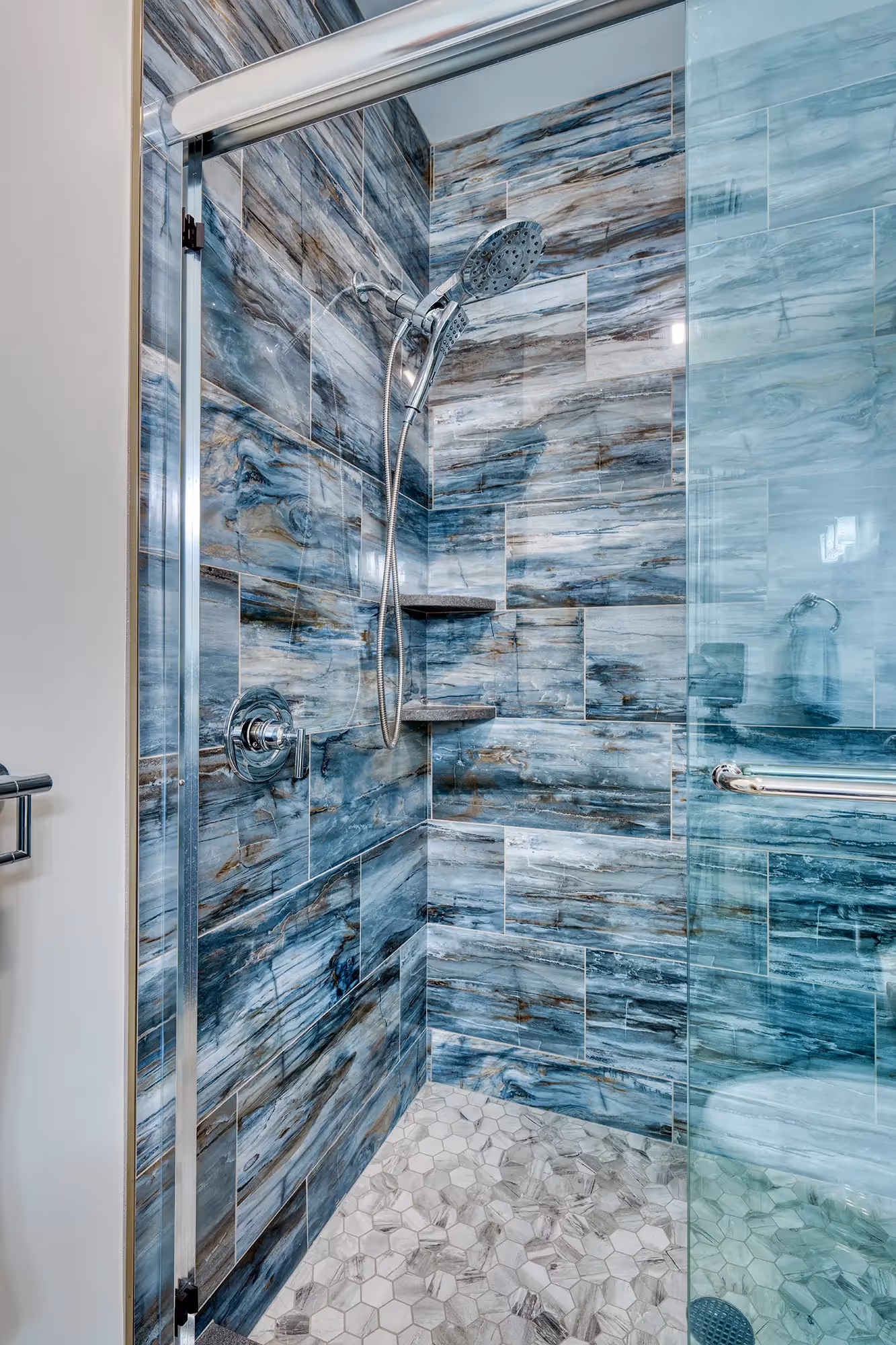 Elegant shower area with beautiful glass tiles