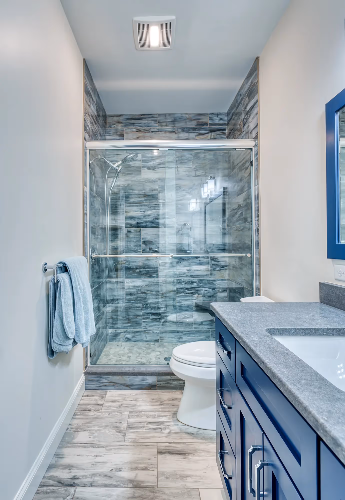 Elegant shower area with beautiful glass tiles