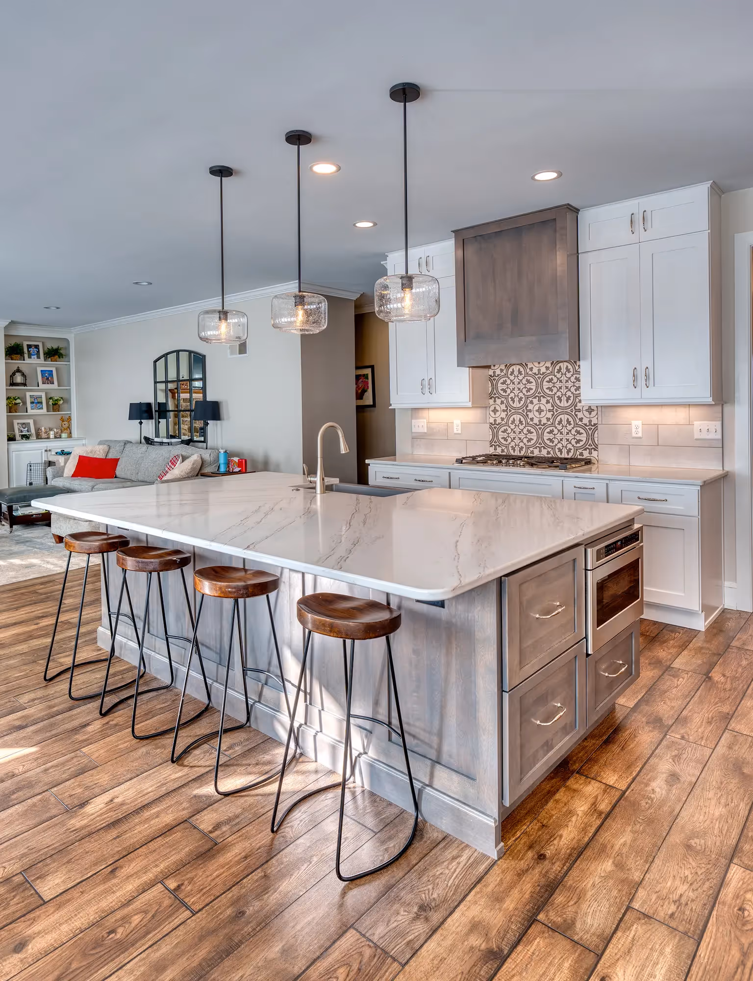 Modern kitchen with large central island and stools
