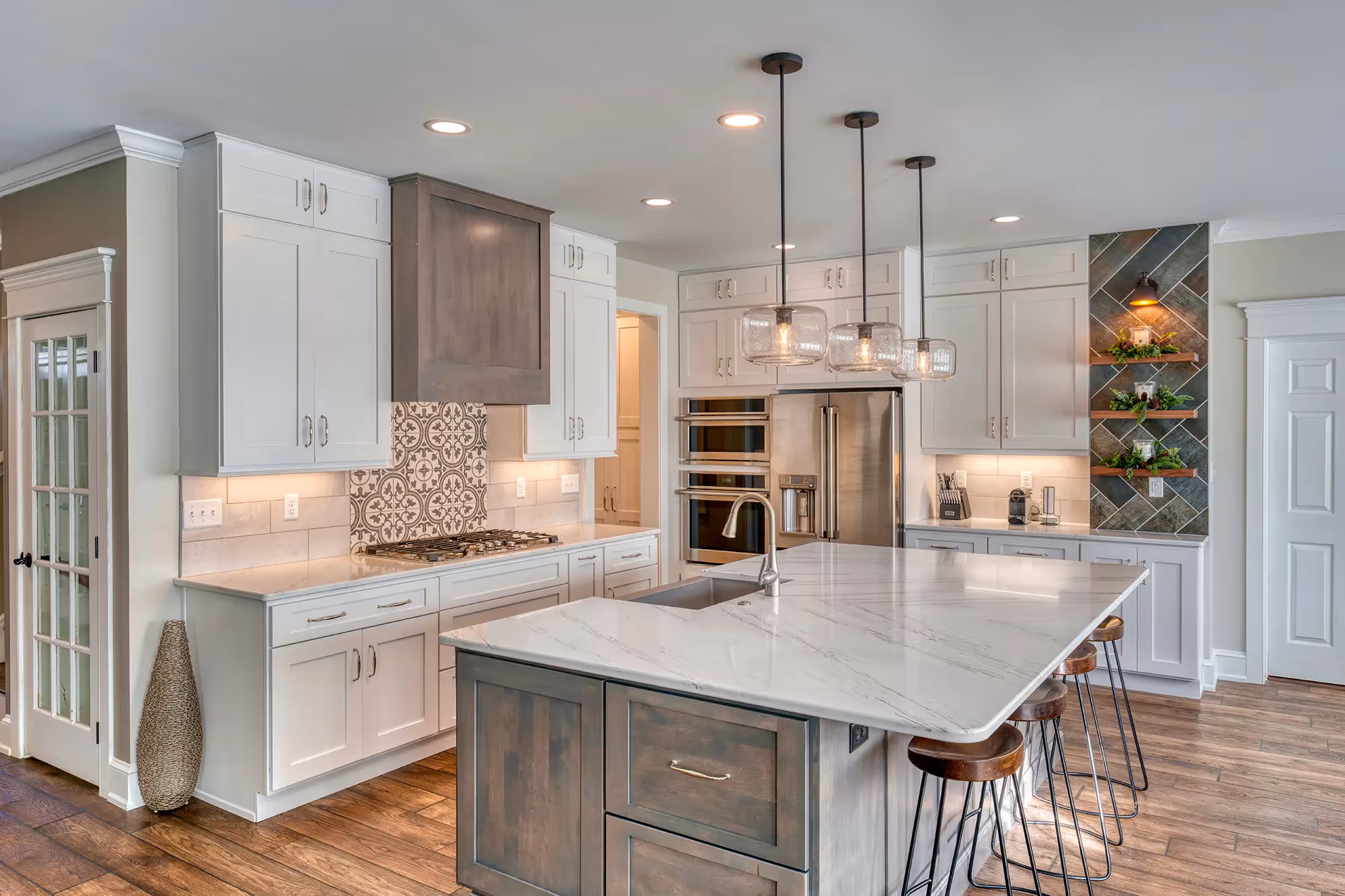 Close-up of modern kitchen sink with gold faucet.