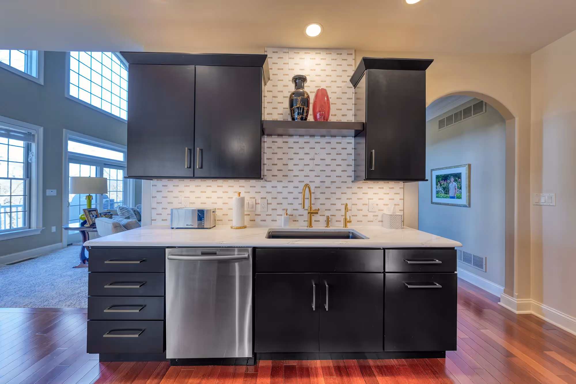 Contemporary kitchen with dark cabinetry